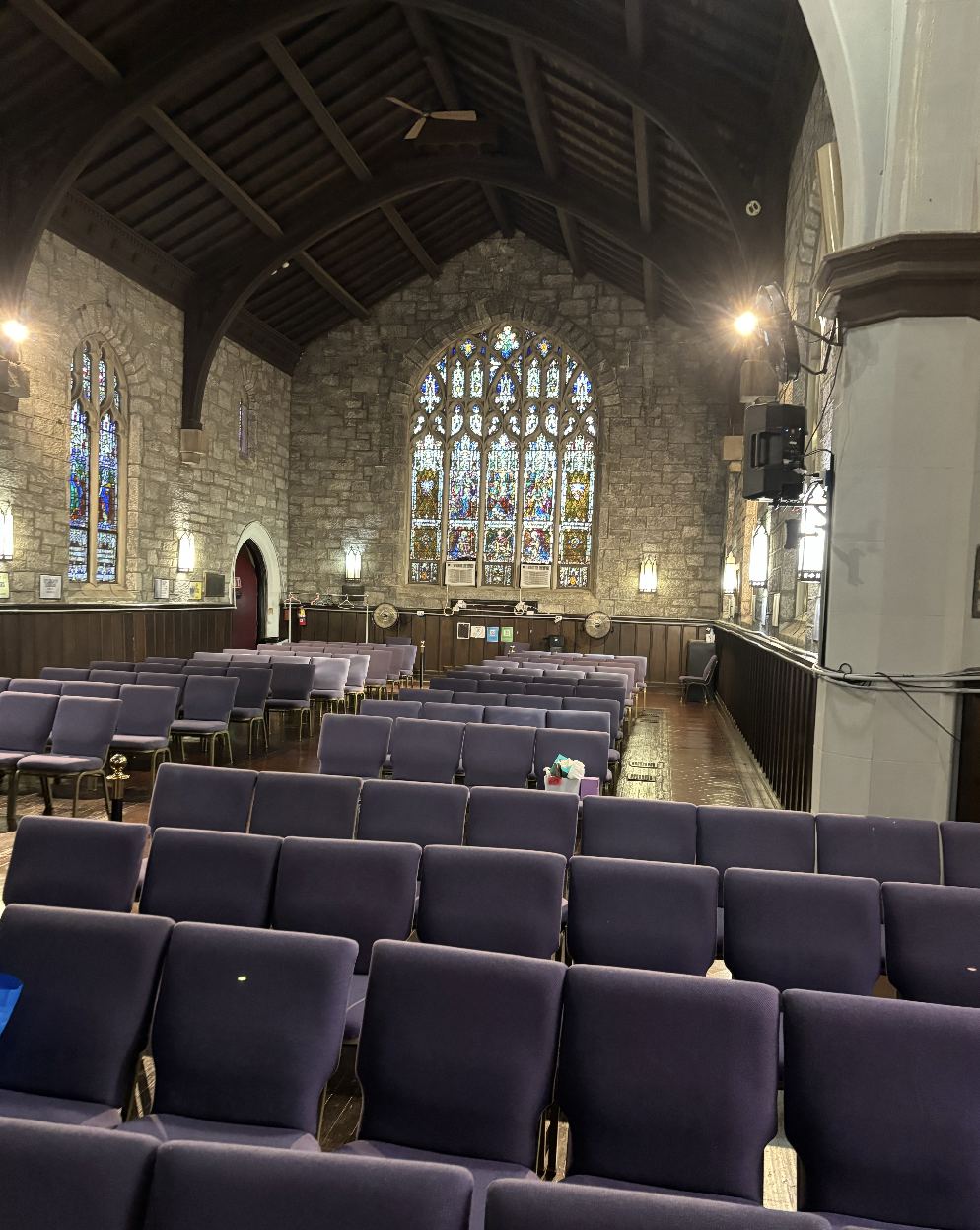 Church sanctuary with clean floors and neatly arranged chairs