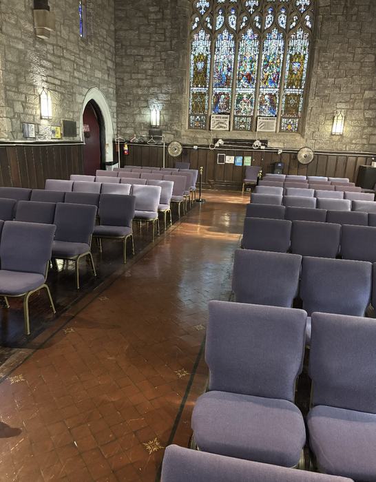 Church center aisle with polished tile floor