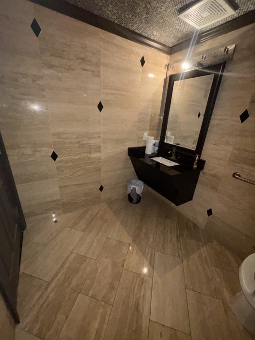 Commercial restroom vanity, cleaned and restocked