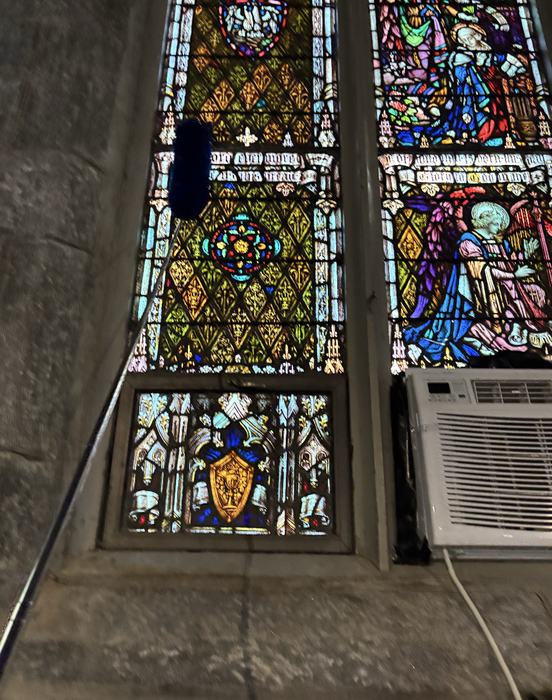 High dusting around a church's stained glass windows